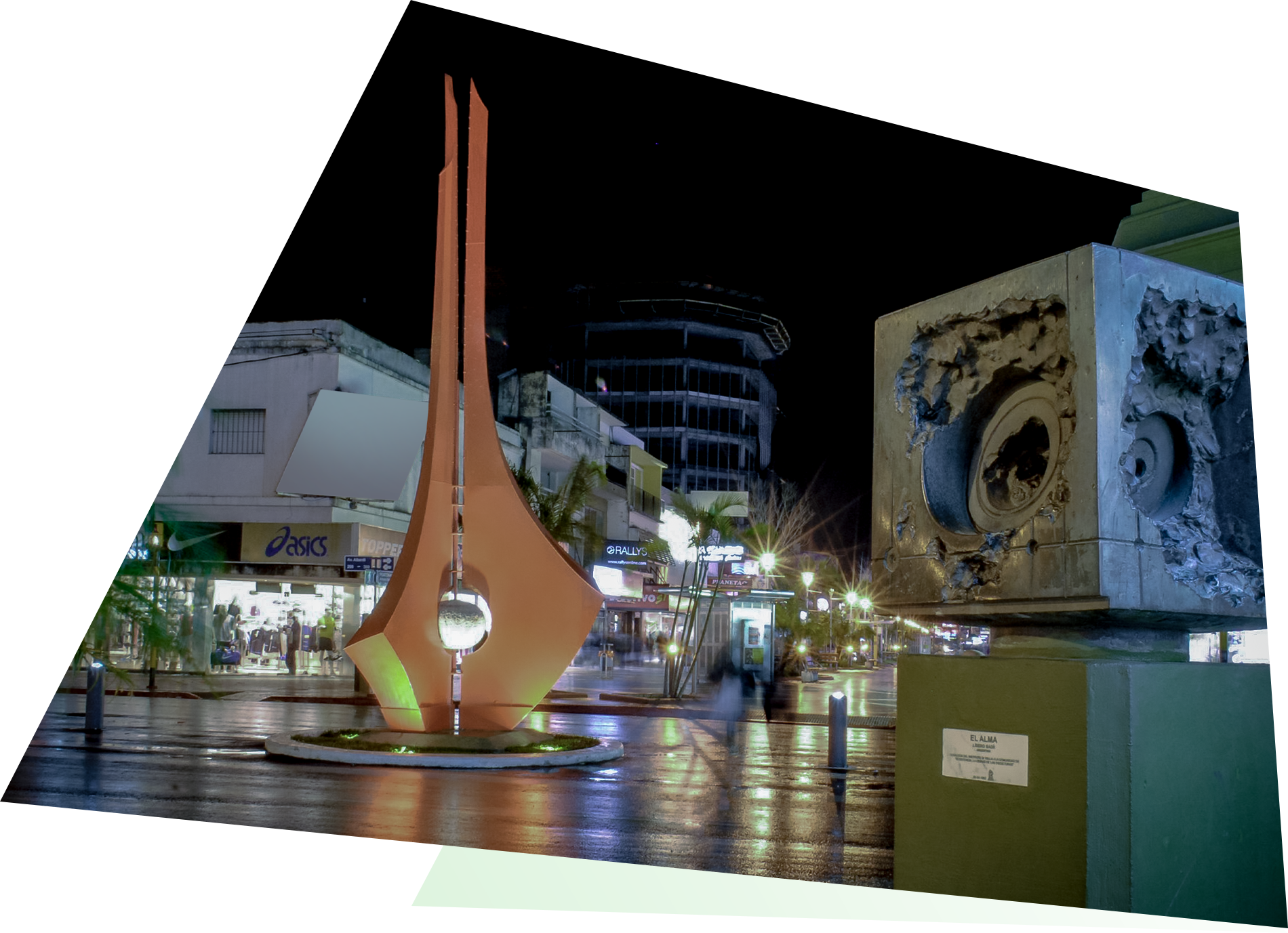 Nighttime urban scene with sculptures